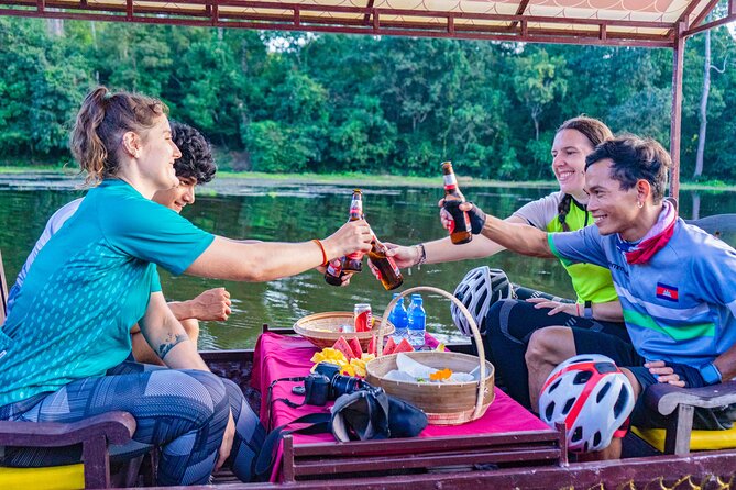 Angkor Bike & Gondola Ride at Twilight - A dragon boat on the Angkor Thom moat