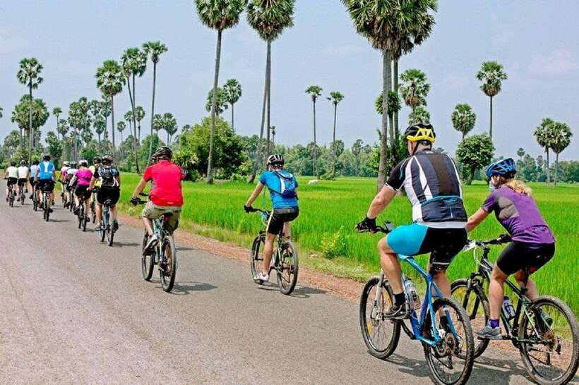 Angkor Bike tour & Gondola Sunset Boat w/ Drinks & Snack - Cycling across the river and behind Angkor Wat
