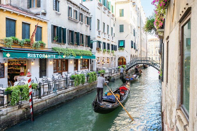 Venice: Classic 30-Minute Gondola Ride Through the Canals - Boarding a traditional gondola